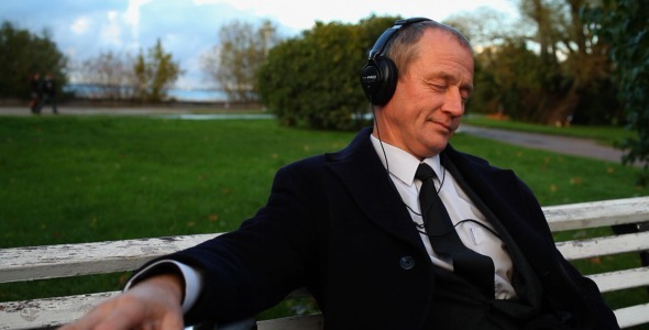 Senior_Businessman_Enjoying_Music_Outside__2